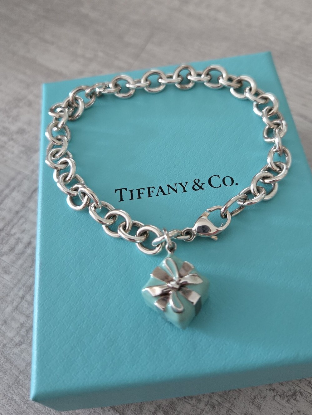 Tiffany & Co. Sterling Silver bracelet with “gift box”Charm.
